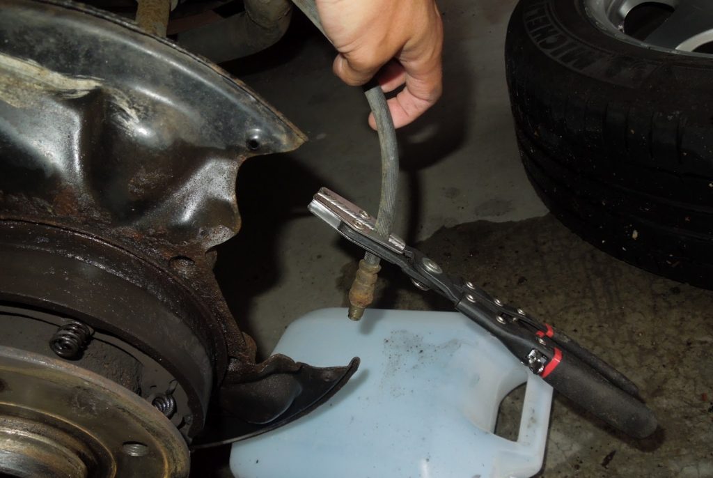 clamping the brake hose with clamper