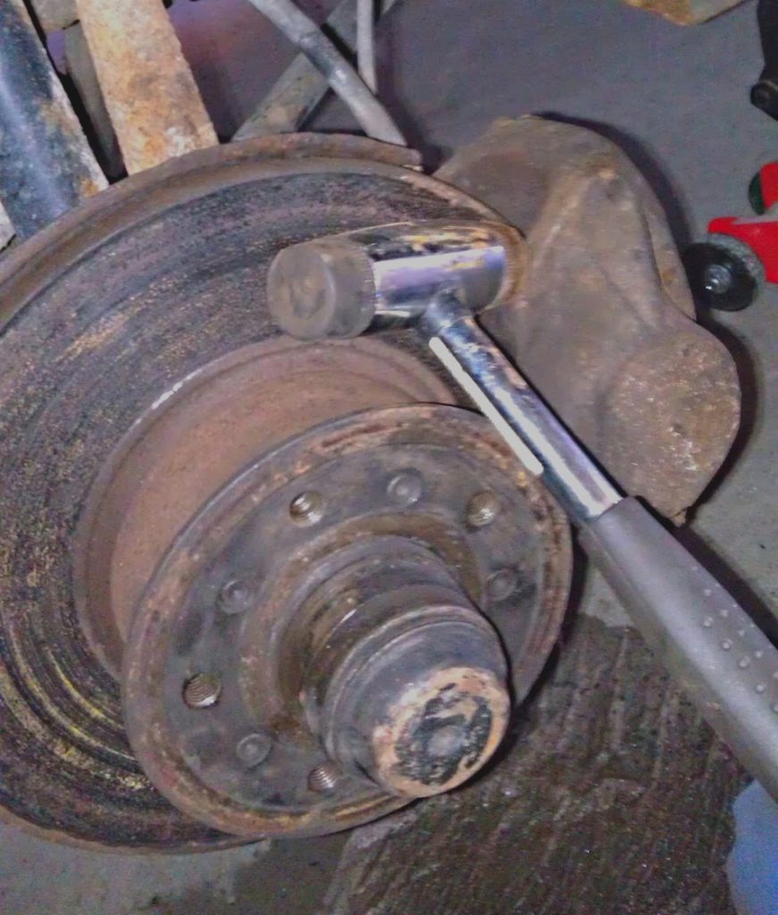 front caliper stuck, remving with a hammer