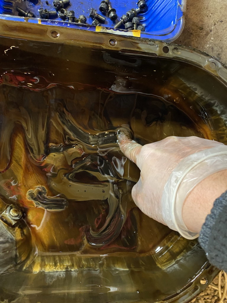 sludge in bottom of oil pan